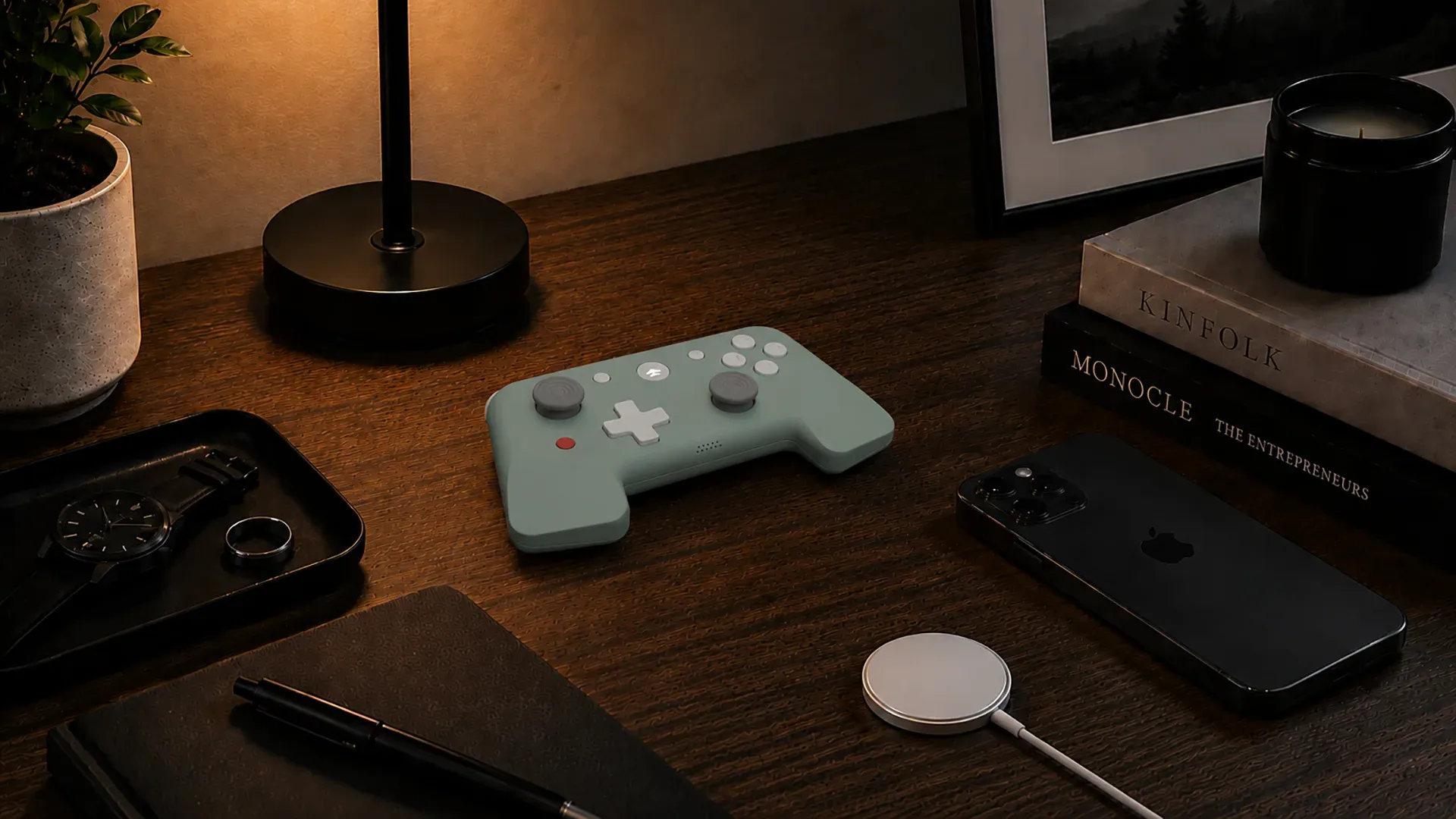 KiteGo controller in a warm desk setup with personal devices